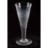 An 18th / 19th century oversized drinking glass, 30cms (12ins) high.
