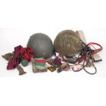 A quantity of original British Army equipment and badges, including Stable Belts, Lanyards, W.O.s