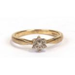 A 9ct gold diamond flower ring, approx UK size 'M'.