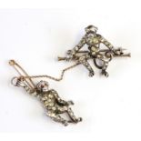 A late 19th century Knoll & Pregizer silver and gold paste double monkey brooch.