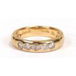 An 18ct gold five-stone diamond ring, approx. UK size 'M'. 4.4g