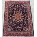 A fine Persian Tabriz woollen hand knotted carpet decorated in the Gonbad design with central