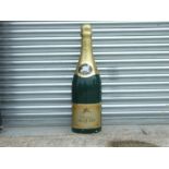 A large Jacquart shop display champagne bottle, 99cms (39ins) high.
