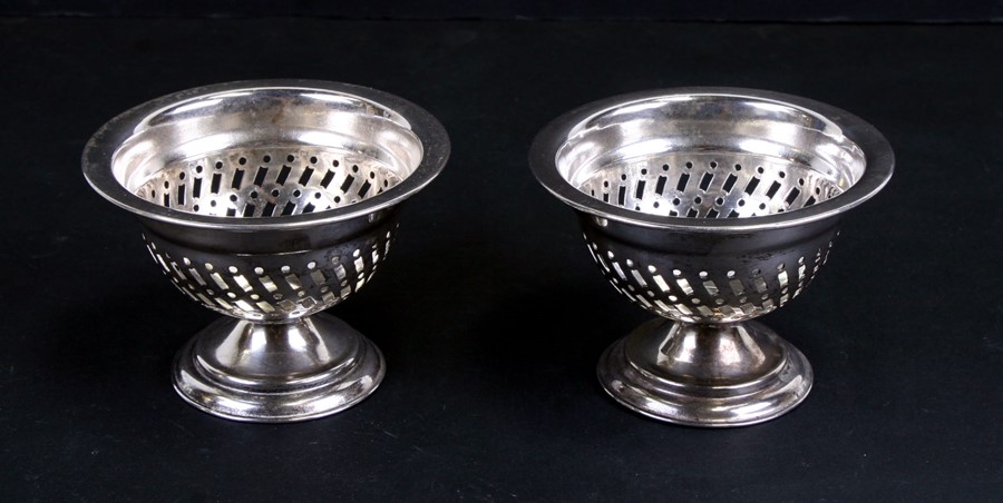 A pair of silver plated pedestal bon bon dishes with pierced decoration, 10cms (4ins) diameter (2).