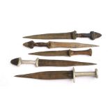 Five assorted African Daggers, all with double edged blades. The longest blade is 25cms (9.875ins)