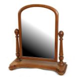A pine swing frame toilet mirror, 74cms (29ins) wide.