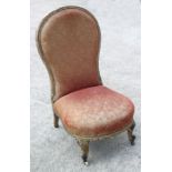 A 19th century gilt gesso spoon back occasional chair with upholstered seat and back.