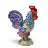 A Basil Matthews Studio pottery figure of an oriental cockerel, 15cms (6ins) high.