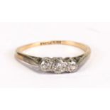 An 18ct gold and platinum three-stone diamond ring, approx UK size 'K'.