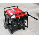 A Clarke FG4050ES 4.5kVA portable petrol generator fitted with pneumatic tyred wheels and twin