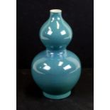 A Chinese robin egg glaze double gourd vase with six character black mark to the underside, 24cms (