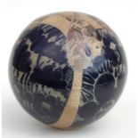 A Studio Pottery globe decorated with stylised trees, 19cms 97.5ins) diameter.