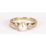 A 9ct gold pearl dress ring, approx UK size 'N'.