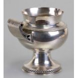 An Arts & Crafts silver footed jug with pierced scroll handle and foot rim with pierced