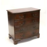 A reproduction figured mahogany bowfront chest of four graduated long drawers, on bracket feet,