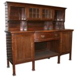 A Liberty and Co Milverton oak buffet sideboard, on square section legs, bow fronted base with