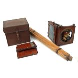 A Victorian Thornton Pickard mahogany triple-plate camera with plates and tripod, cased.