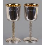 A pair of silver gilt goblets, weight 490g, London 1971, 17cms (6.6ins) high (2).Condition