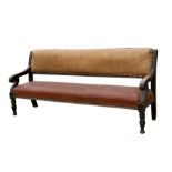 A 19th century country house mahogany settle with upholstered back and seat, with scroll arms and