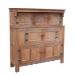 After Derek Slater (Lizard Man) a 17th century style limed oak court cupboard, three panelled