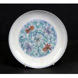 A Chinese Ducai style shallow dish decorated with scolling flowers, six character blue mark to the