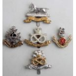 Five Military cap badges: The Loyal Regiment, The North Staffordshire Regiment, The South