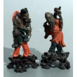 A pair of Chinese Foochow style lacquered figures modelled as wise men, 22cms (8.6ins) high (2).