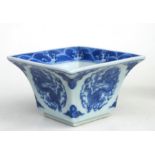 A Chinese blue and white square form bowl decorated dragons with blue seal mark to the underside.6cm