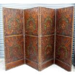 An embossed and tooled leather four-fold screen, overall 272 by 184cms (107 by 72.5ins).Condition