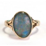 A 9ct gold and opal dress ring, approx. UK size 'M'.Condition Reportthe polished opal surface is now