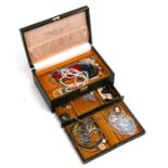 A jewellery box containing a quantity of costume jewellery.