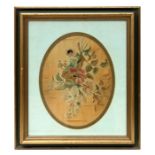 A 19th century oval silk needlework embroidery depicting flowers, framed & glazed, 24 by 30cms (9.