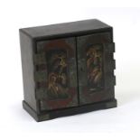 A Japanese lacquered table cabinet, 15cms (6ins) wide.
