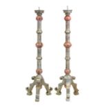 A pair of painted carved wood pricket candlesticks, 79cms (31ins) high (2).