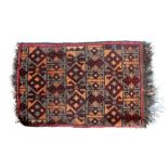 A small Persian rug decorated with geometric designs, 58 by 40cms (22.75 by 15.75ins).