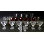 A set of six etched glasses with lemon squeezer bases; together with other glassware.