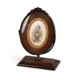 A Victorian swivel stained beech and gilt brass photo frame, 15cms (6ins) wide.