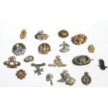An assortment of 18 mainly Military cap badges