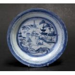 A Chinese blue and white plate decorated a river scene. 25cm (9.75 ins) diameterCondition