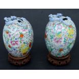 A pair of Chinese millefiori ovoid vases, the necks with applied chilong, red character mark to