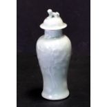 A Chinese celadon vase and cover of baluster form, the cover with dog of fo finial, 16cms (6.