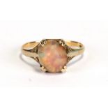 A 9ct gold and opal dress ring, approx UK size 'N'.