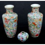 A pair of Chinese millefiore vases of cylindrical shouldered form, character mark to base, 23cms (