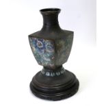 A large Chinese bronze vase with detailed chasing to neck, shoulder and base, a square shaped