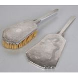 A Chinese silver Art Deco style dressing table hand mirror and brush, both backs engraved with