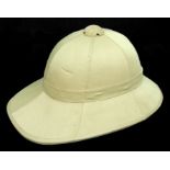 A pith type helmet with adjustable chin strap.