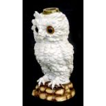 A pottery figural owl lamp base with glass eyes, 33cms (13ins) high.Condition Reportdirty but no