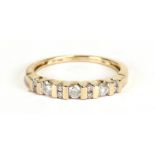 A 10ct gold and Zircon half-hoop ring, approx UK size '