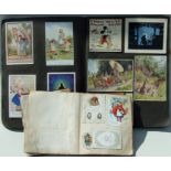 A Late Victorian scrap album comprising advertising, Christmas cards and silks; together with a