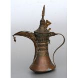 A Turkish / Islamic copper dallah coffee pot, 21cms (8.25ins) high.